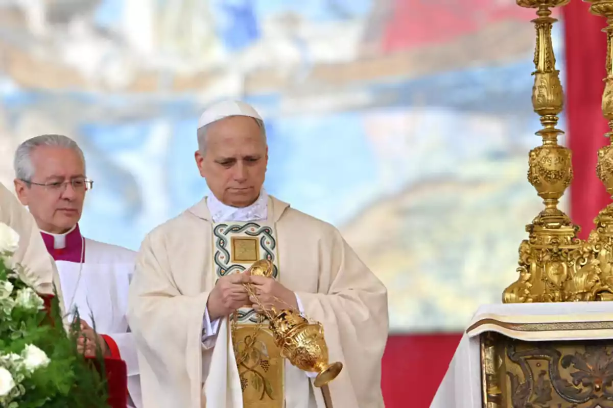 A Catholic priest holds a golden censer during a religious ceremony accompanied by another clergyman in front of a decorated altar. A Catholic priest holds a golden censer during a religious ceremony accompanied by another clergyman in front of a decorated altar.