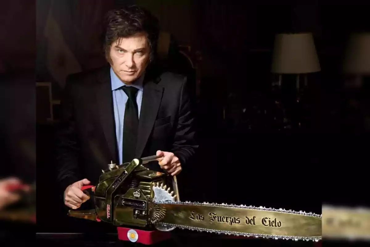 A man in a dark suit holds a golden chainsaw with the inscription "The Forces of Heaven" in a dark setting.