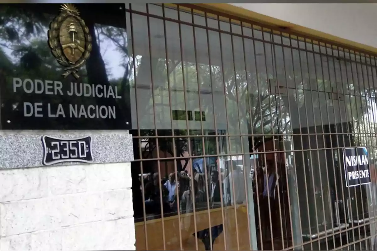 Facade of a National Judiciary building with bars and a sign that says Facade of a National Judiciary building with bars and a sign that says