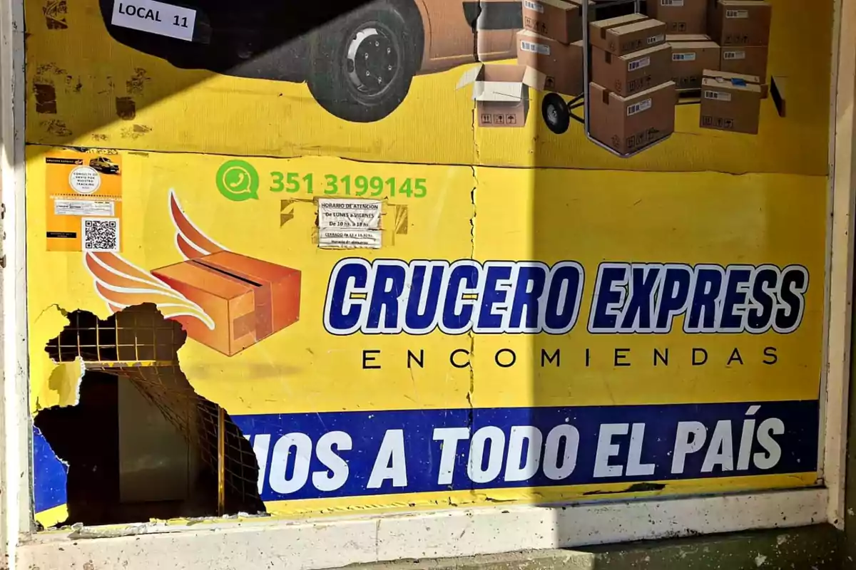 Yellow sign from a shipping company called Crucero Express with a large hole in the lower left part of the ad Yellow sign from a shipping company called Crucero Express with a large hole in the lower left part of the ad