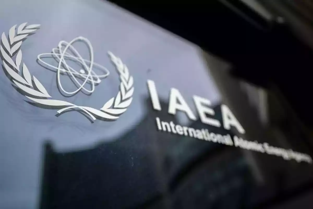Logo of the International Atomic Energy Agency on a glass surface