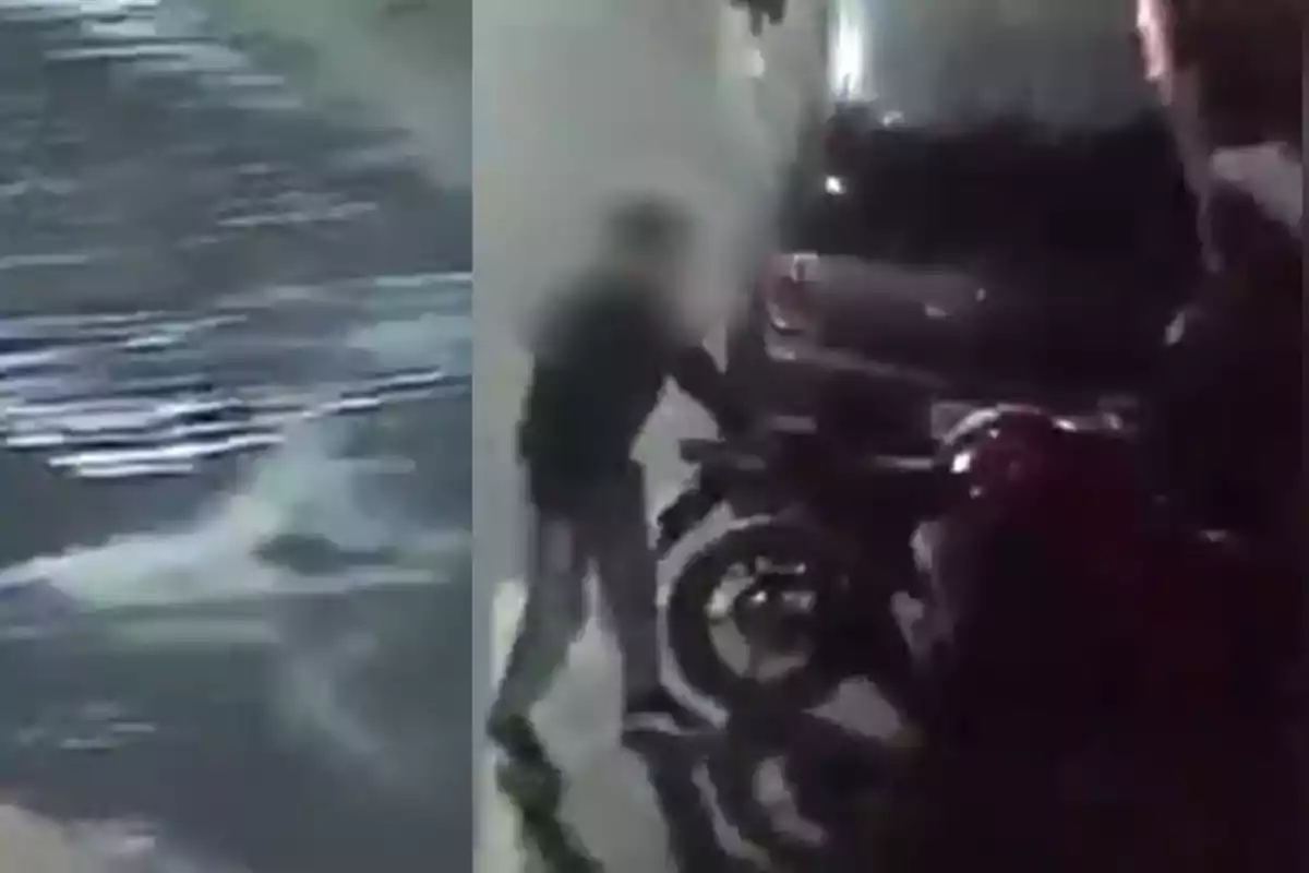 Person next to a motorcycle on a wet street at night