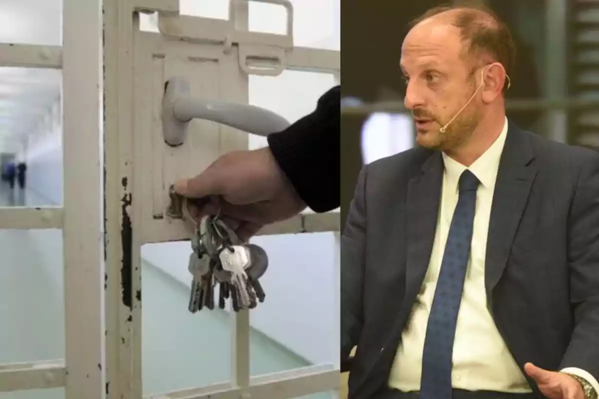 A hand holds a bunch of keys and opens the door of a cell while a man in a suit with a headset microphone is sitting and speaking.