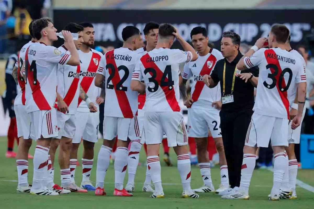 A group of River Plate players listens to their coach's instructions during a match. A group of River Plate players listens to their coach's instructions during a match.