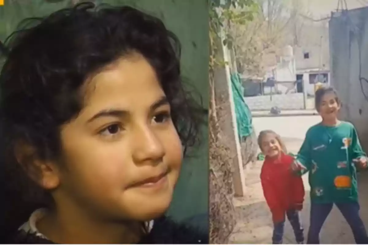 Curly-haired girl looking to the side, with two smiling girls playing in the background on a narrow street Curly-haired girl looking to the side, with two smiling girls playing in the background on a narrow street