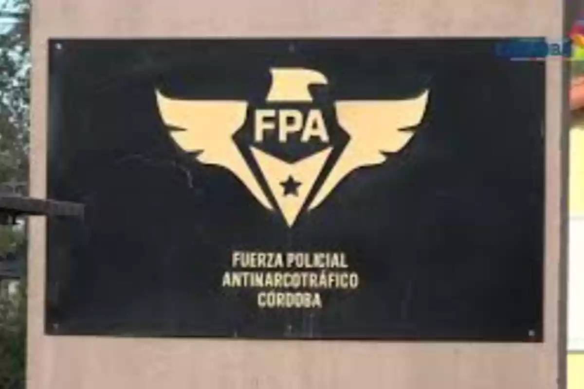 Black poster with a golden eagle logo and the initials FPA, accompanied by the text Córdoba Anti-Narcotics Police Force Black poster with a golden eagle logo and the initials FPA, accompanied by the text Córdoba Anti-Narcotics Police Force