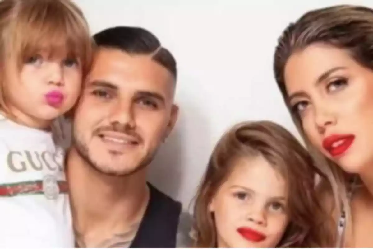 Family posing together with two girls and two adults, all with red lipstick on. Family posing together with two girls and two adults, all with red lipstick on.