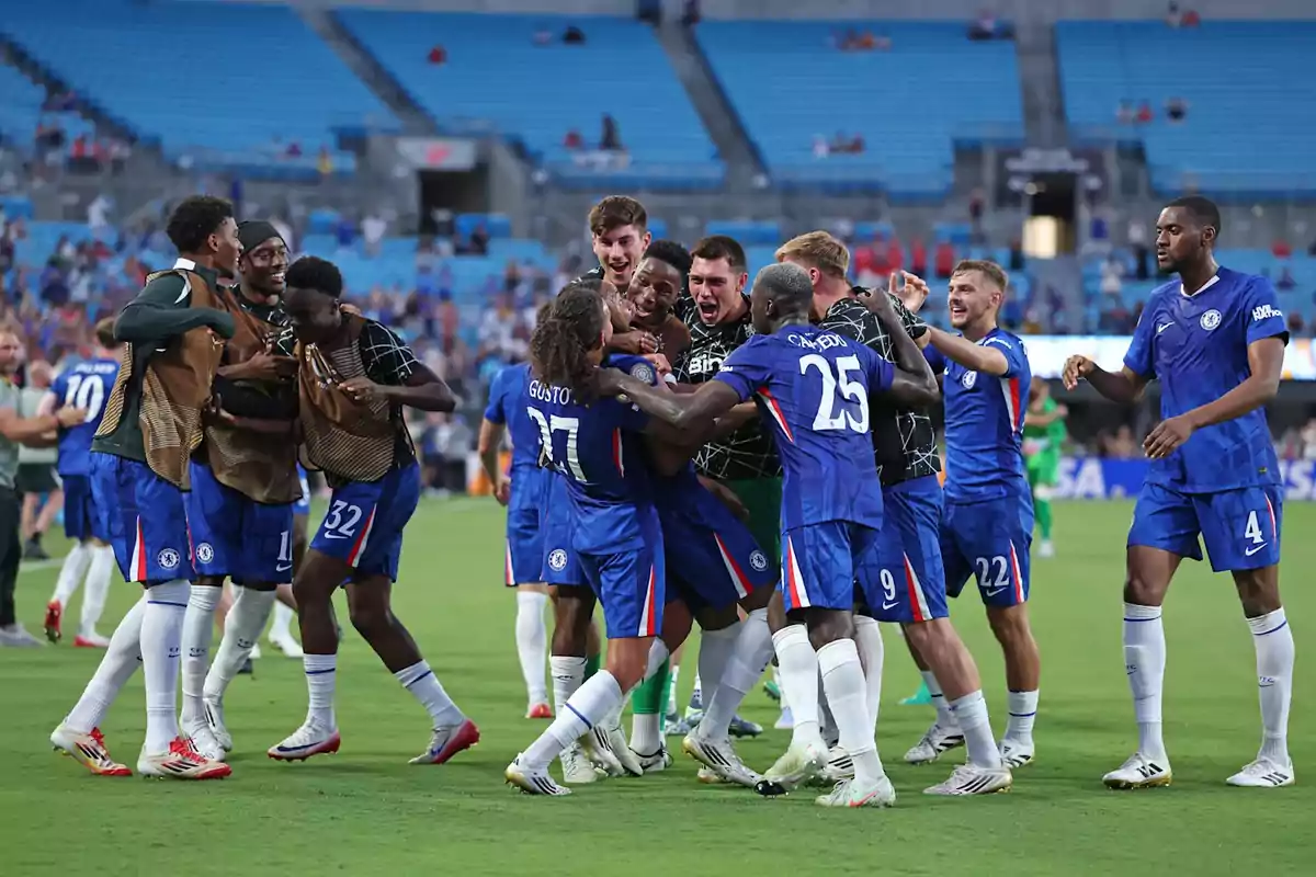 Chelsea football players celebrate together on the field after a match, showing joy and camaraderie while the stadium is partially filled. Chelsea football players celebrate together on the field after a match, showing joy and camaraderie while the stadium is partially filled.