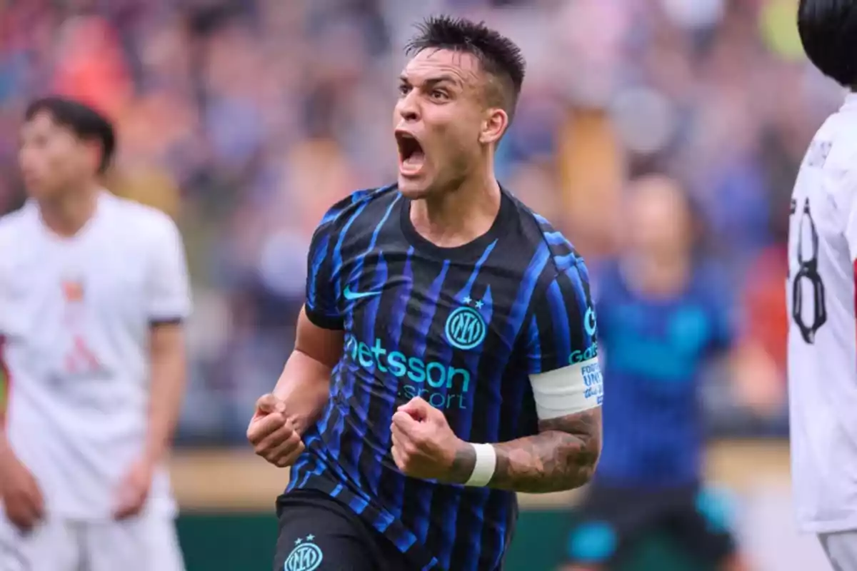 Soccer player in a blue and black uniform celebrating enthusiastically on the field during a match Soccer player in a blue and black uniform celebrating enthusiastically on the field during a match