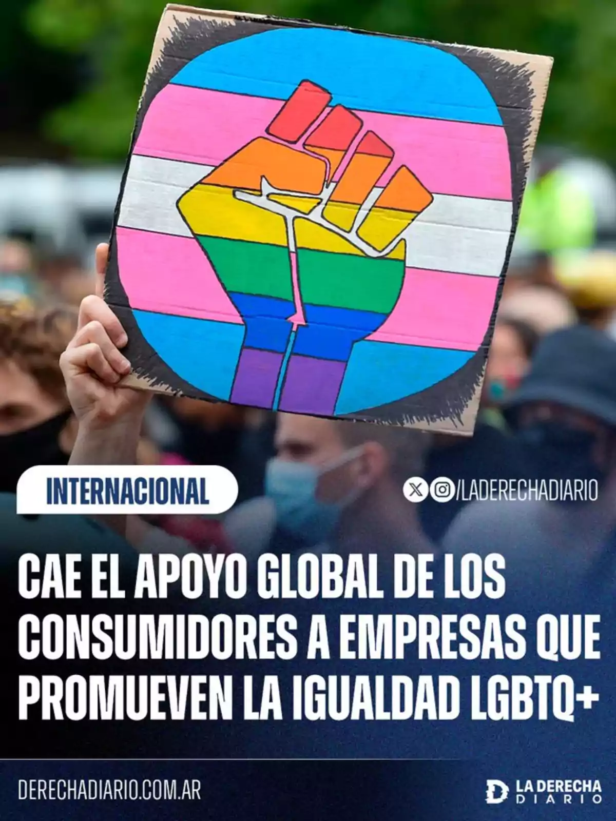 Person holds a sign with a fist painted in the colors of the LGBTQ+ flag and the trans flag, accompanied by text mentioning the decline in global support for companies that promote LGBTQ+ equality. Person holds a sign with a fist painted in the colors of the LGBTQ+ flag and the trans flag, accompanied by text mentioning the decline in global support for companies that promote LGBTQ+ equality.