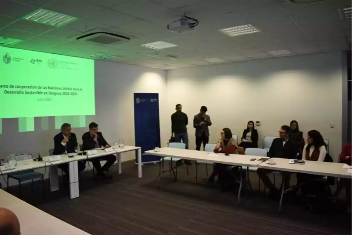 People gathered in a conference room participating in a presentation on the United Nations cooperation framework for sustainable development in Uruguay. People gathered in a conference room participating in a presentation on the United Nations cooperation framework for sustainable development in Uruguay.