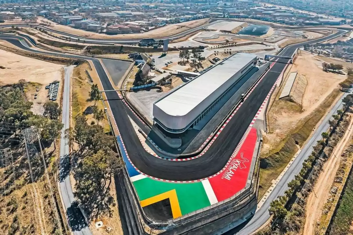 Aerial view of a racetrack with a curve decorated with the colors of the South African flag and the word Kyalami Aerial view of a racetrack with a curve decorated with the colors of the South African flag and the word Kyalami