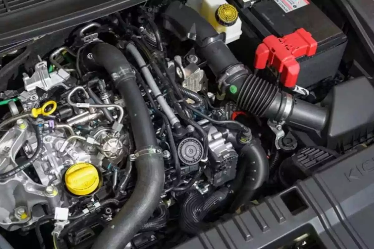 Modern car engine with various hoses, wires, and visible components Modern car engine with various hoses, wires, and visible components