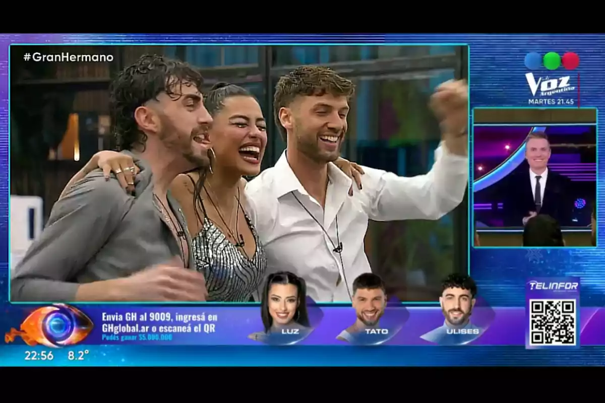 Three Big Brother contestants smile and hug each other in celebration while the host and voting information appear on the screen. Three Big Brother contestants smile and hug each other in celebration while the host and voting information appear on the screen.