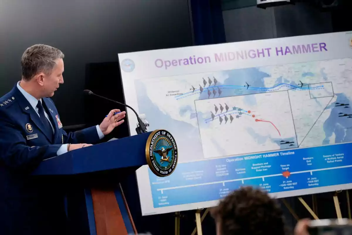 A U.S. military officer presents a report on Operation Midnight Hammer, displaying a strategic map at a Department of Defense press conference.