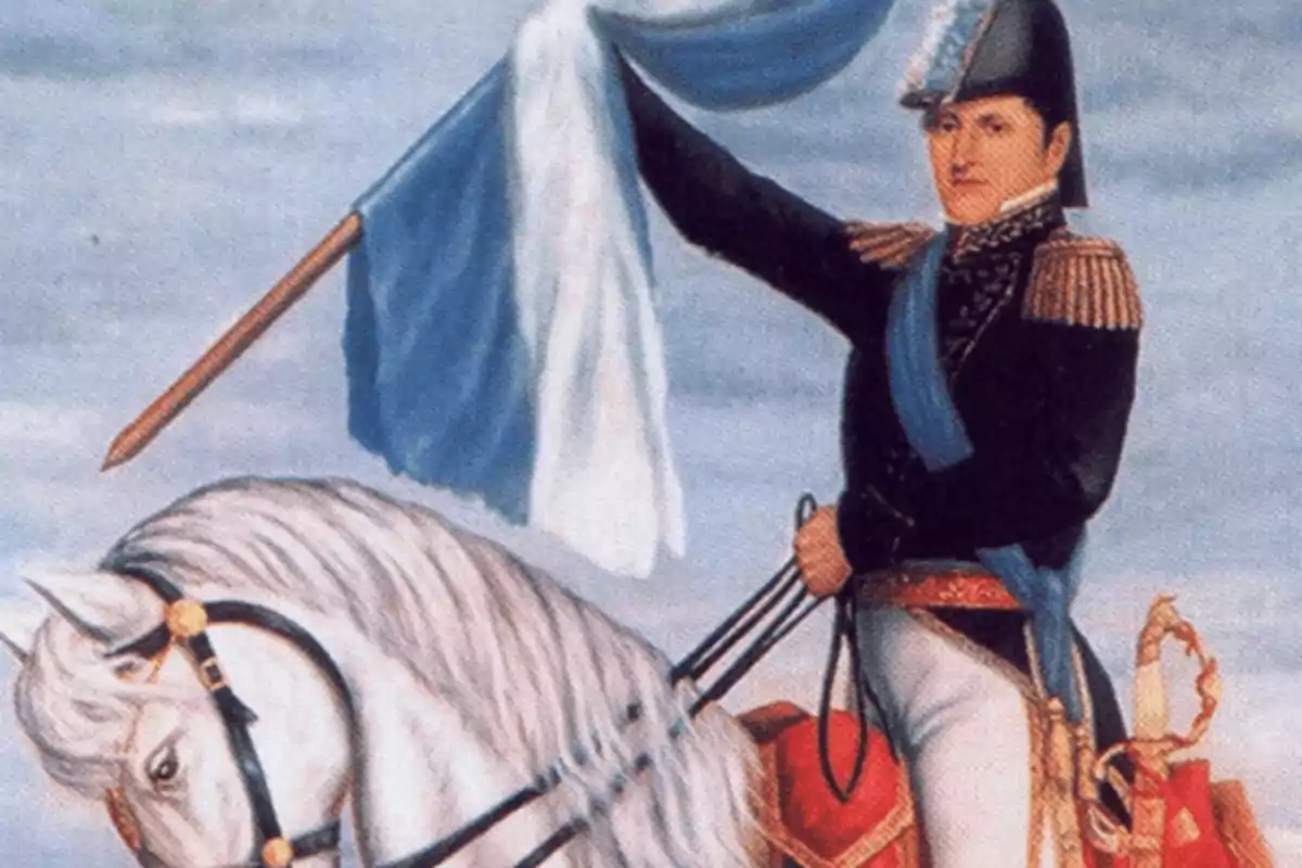 A man in a military uniform rides a white horse while holding a light blue and white flag.