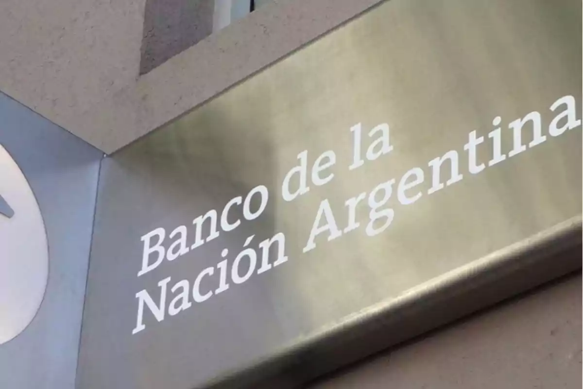 Sign of the Bank of the Argentine Nation on the facade of a building Sign of the Bank of the Argentine Nation on the facade of a building
