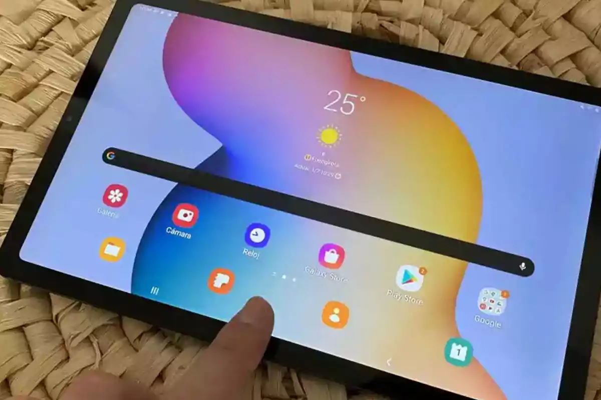 Person using a Samsung tablet with the home screen visible and several apps open on a woven surface Person using a Samsung tablet with the home screen visible and several apps open on a woven surface