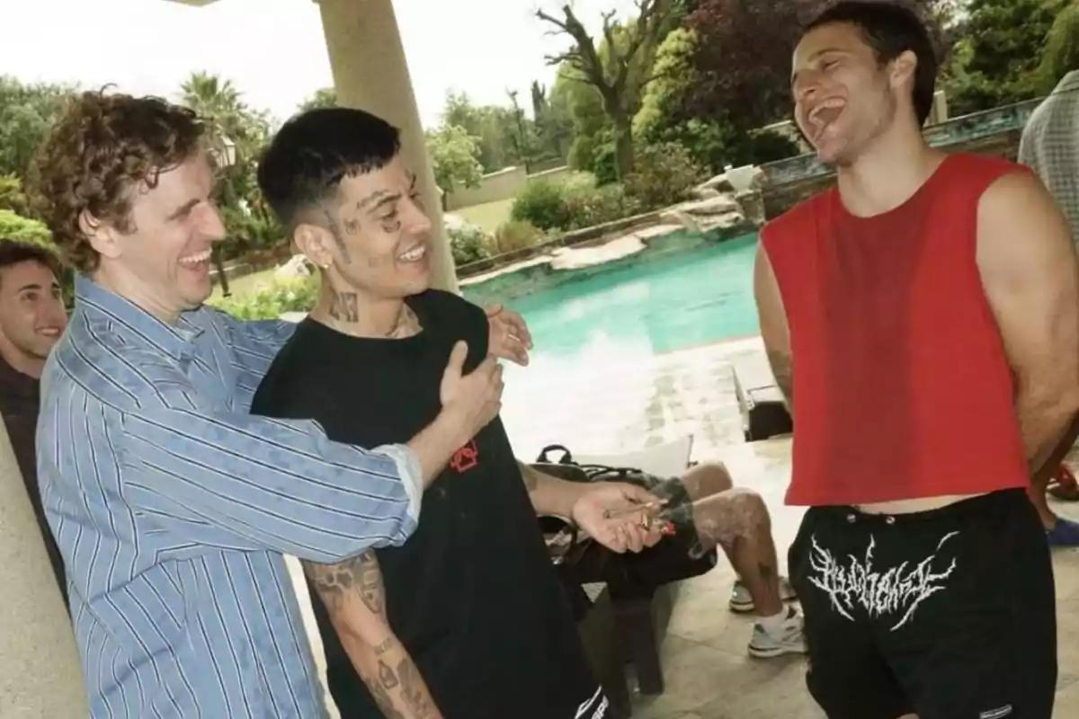 Three young people laugh and talk by a pool in a relaxed, outdoor setting. Three young people laugh and talk by a pool in a relaxed, outdoor setting.
