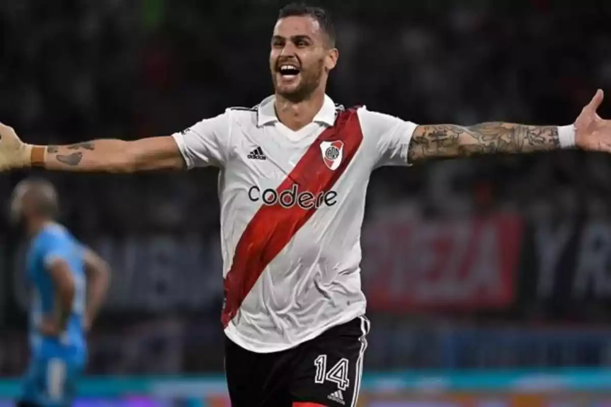 River Plate player celebrating a goal with arms outstretched in the stadium River Plate player celebrating a goal with arms outstretched in the stadium