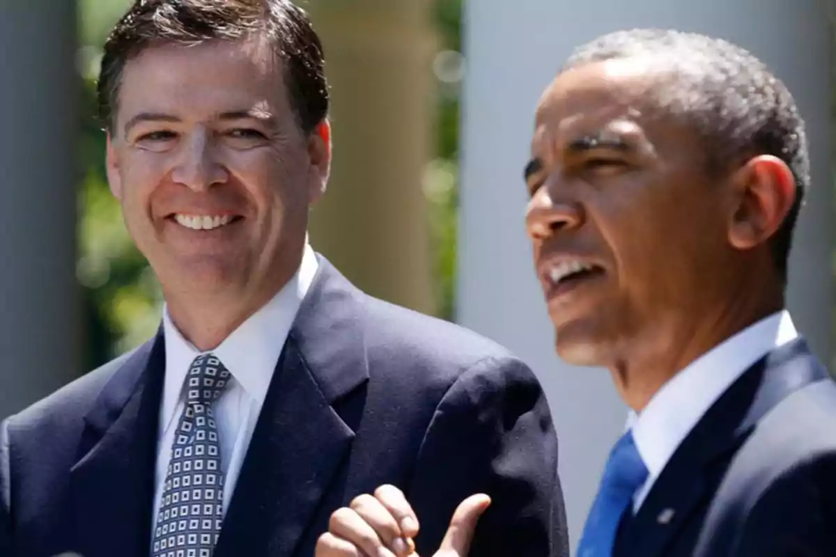 Two men in suits smile and talk outdoors at a formal event. Two men in suits smile and talk outdoors at a formal event.