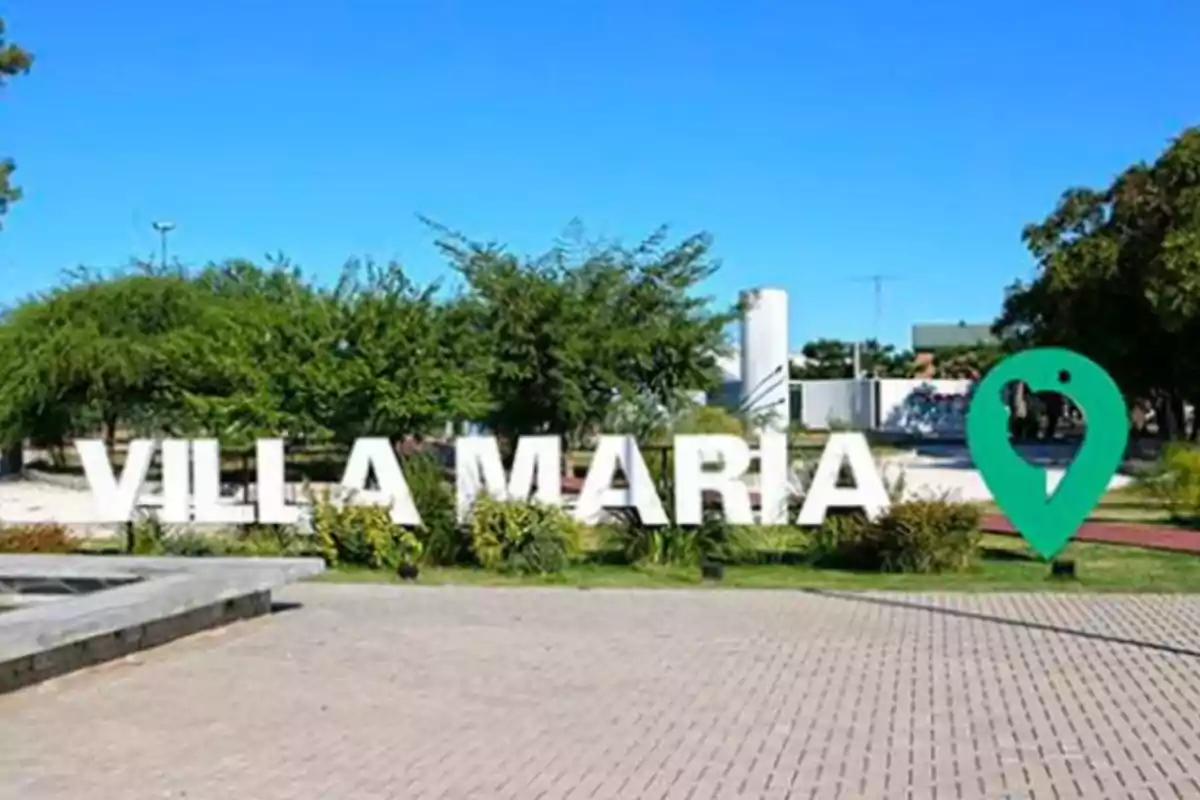 Large Villa María sign in a public space with trees and clear sky Large Villa María sign in a public space with trees and clear sky