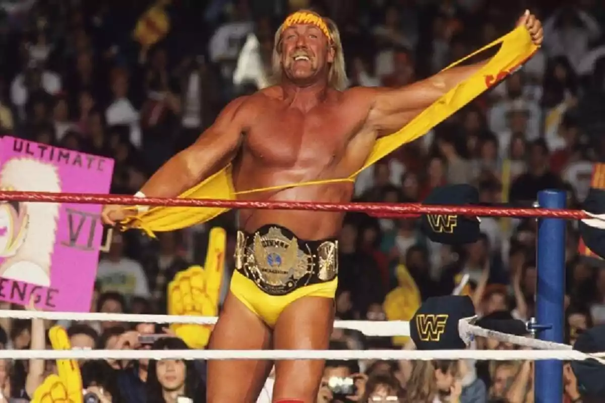 Muscular wrestler in the ring tearing his yellow jersey while wearing a championship belt and a headband, surrounded by an excited crowd Muscular wrestler in the ring tearing his yellow jersey while wearing a championship belt and a headband, surrounded by an excited crowd