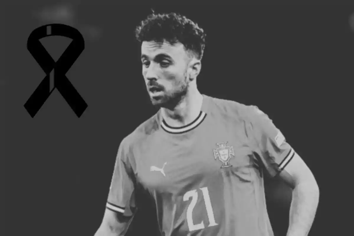 Soccer player wearing Portugal’s uniform with a black mourning ribbon in the top left corner on a dark black and white background