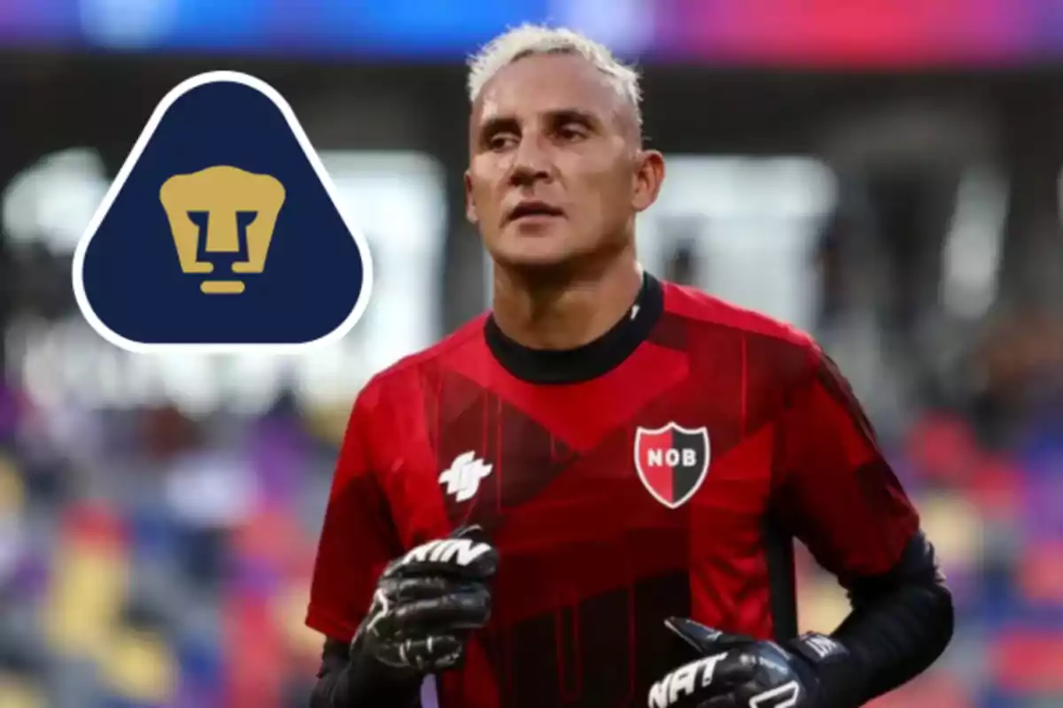 Goalkeeper wearing a red Newell's Old Boys uniform and black gloves on the field, next to the Pumas UNAM logo in the left corner