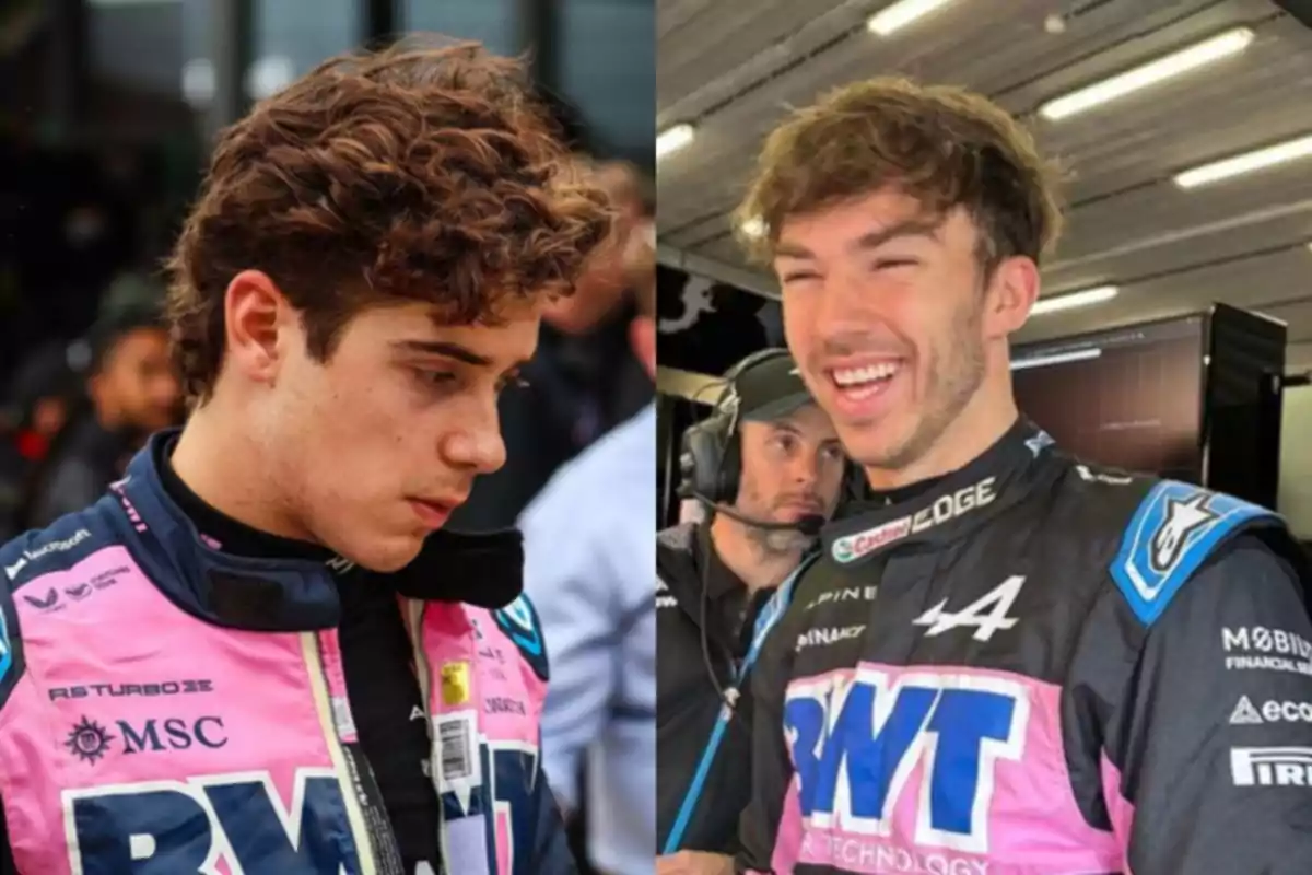Two drivers in racing uniforms, one pink and one blue, one looking serious and the other smiling inside a garage.