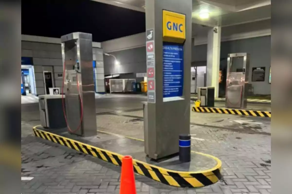 Empty CNG service station at night with orange cones and safety signage Empty CNG service station at night with orange cones and safety signage