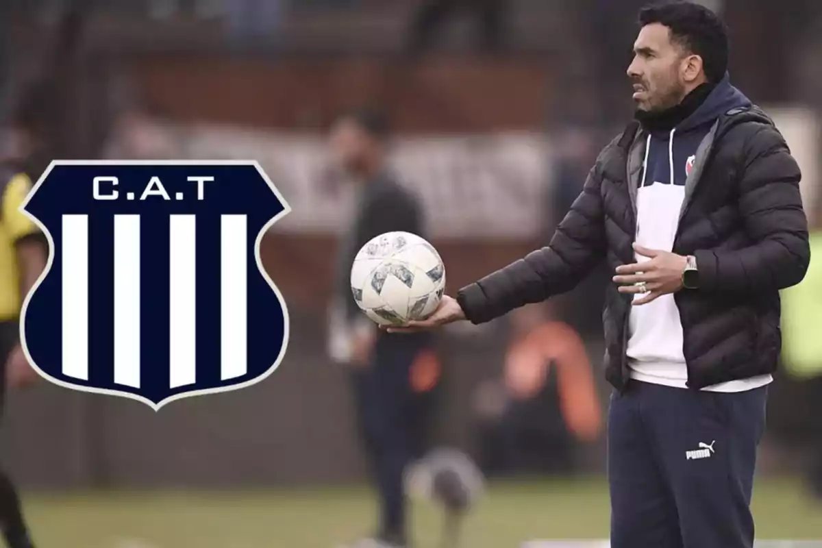 Soccer coach on the field holding a ball next to the Talleres de Córdoba club crest Soccer coach on the field holding a ball next to the Talleres de Córdoba club crest