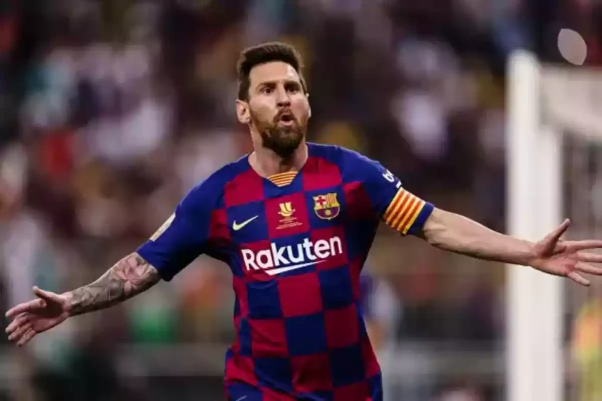 Soccer player in FC Barcelona uniform celebrating a goal with arms outstretched in a stadium Soccer player in FC Barcelona uniform celebrating a goal with arms outstretched in a stadium