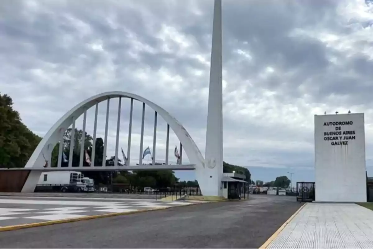 Main entrance of the Buenos Aires Oscar and Juan Gálvez Racetrack with its characteristic white arch and cloudy sky Main entrance of the Buenos Aires Oscar and Juan Gálvez Racetrack with its characteristic white arch and cloudy sky