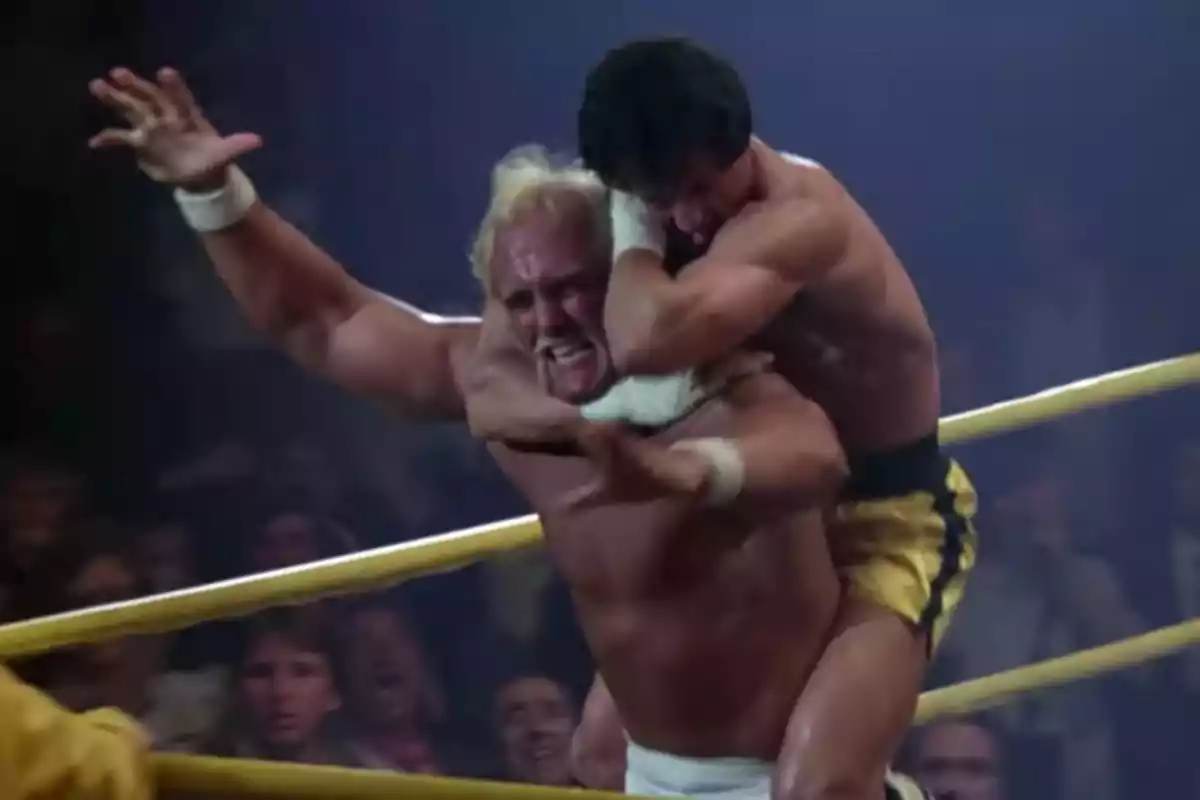 Two wrestlers grapple in the ring as one puts a chokehold on the other in front of an excited crowd. Two wrestlers grapple in the ring as one puts a chokehold on the other in front of an excited crowd.