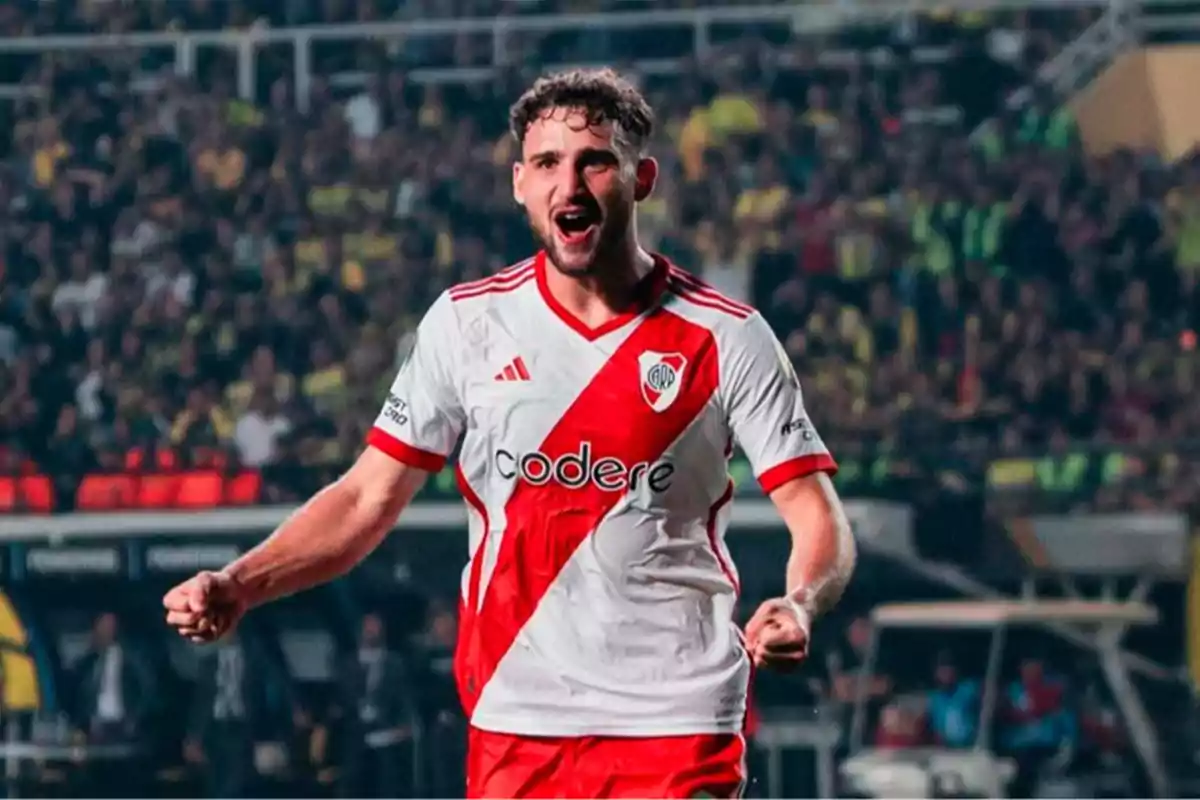 River Plate player celebrating a goal in a stadium full of fans River Plate player celebrating a goal in a stadium full of fans