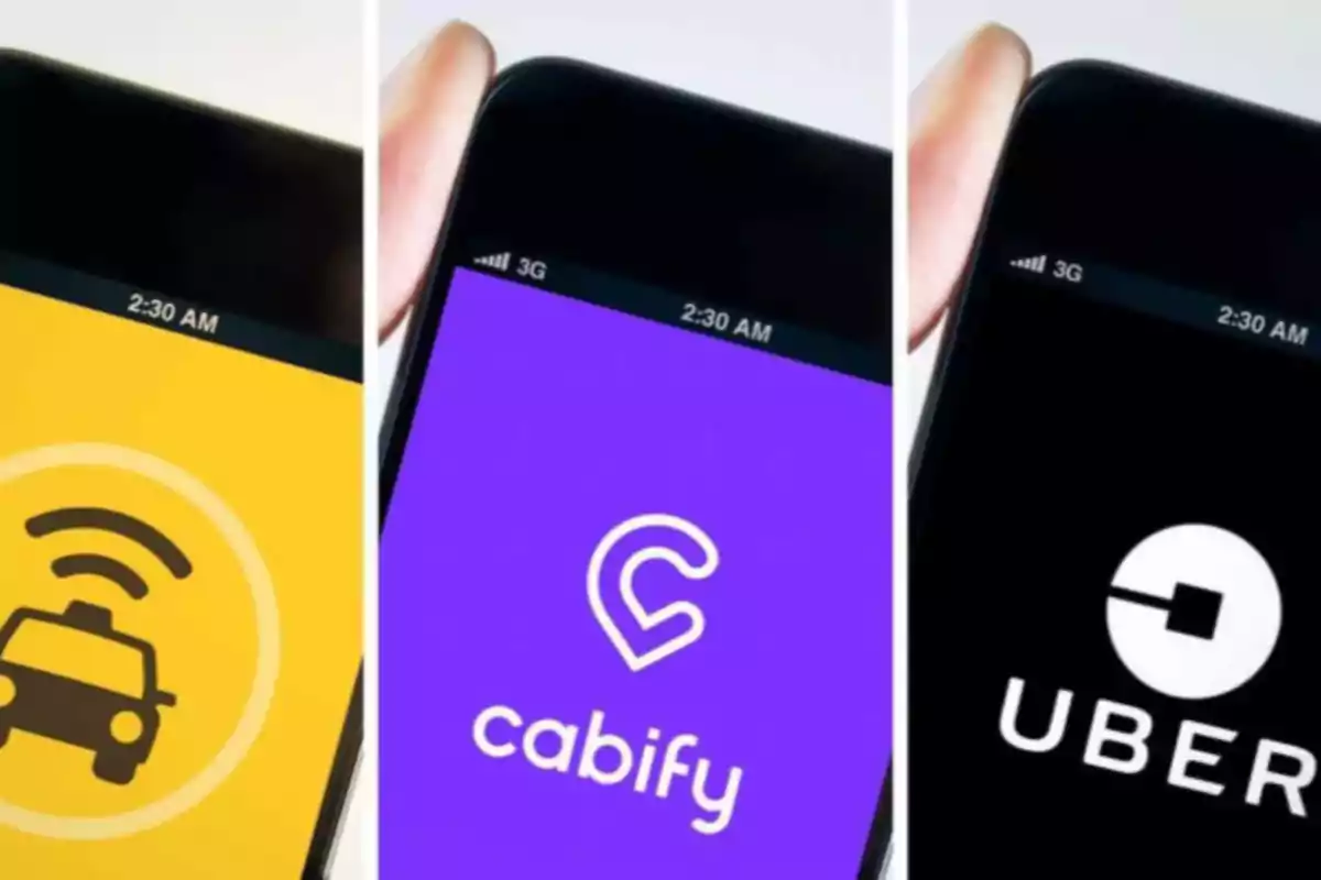 Tres teléfonos móviles muestran las aplicaciones de taxi, Cabify y Uber en sus pantallas.