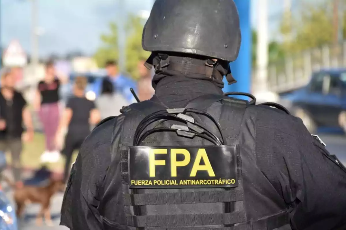 Anti-Narcotics Police Force agent wearing a uniform and protective helmet during an outdoor operation Anti-Narcotics Police Force agent wearing a uniform and protective helmet during an outdoor operation
