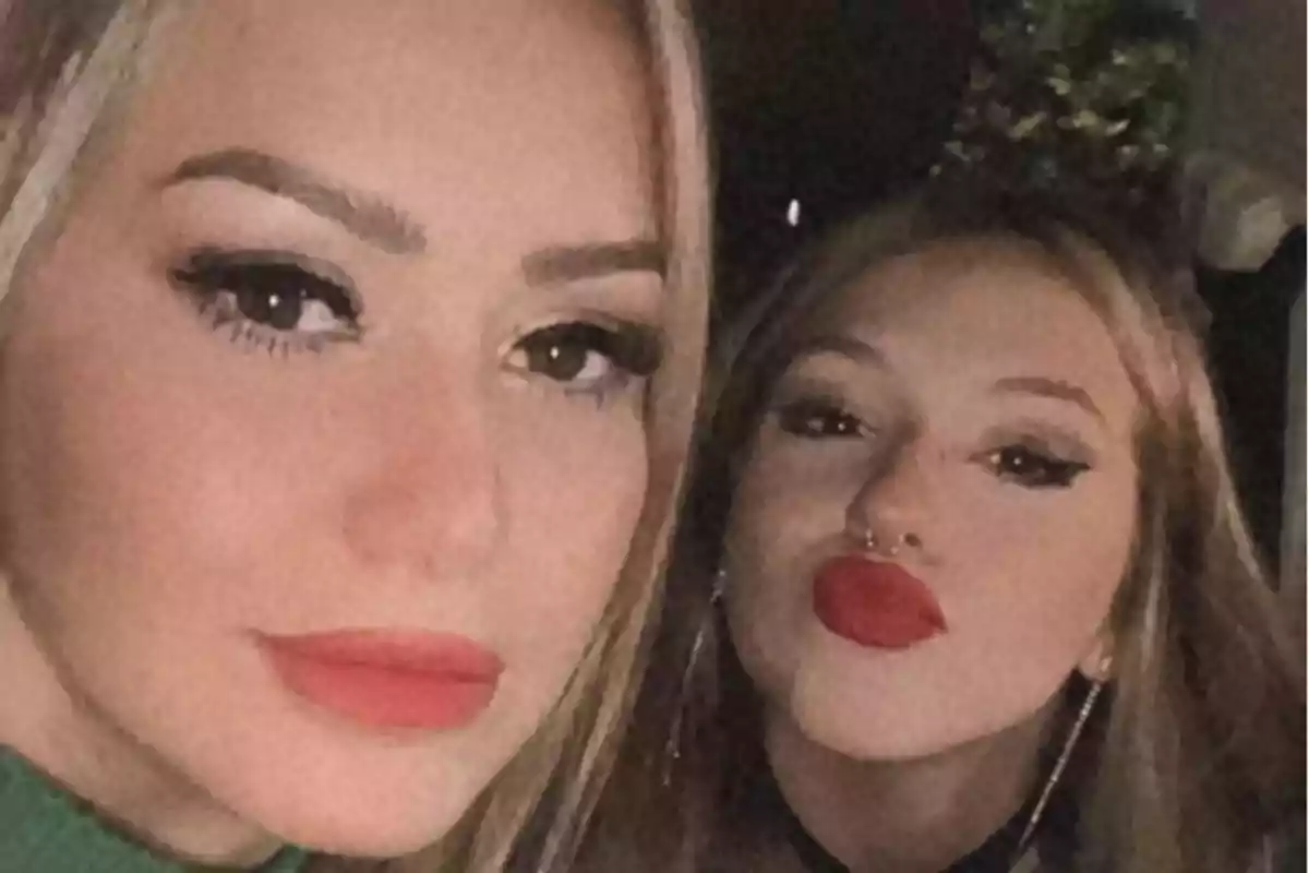 Two girls pose for a selfie with bold makeup and red lips. Two girls pose for a selfie with bold makeup and red lips.