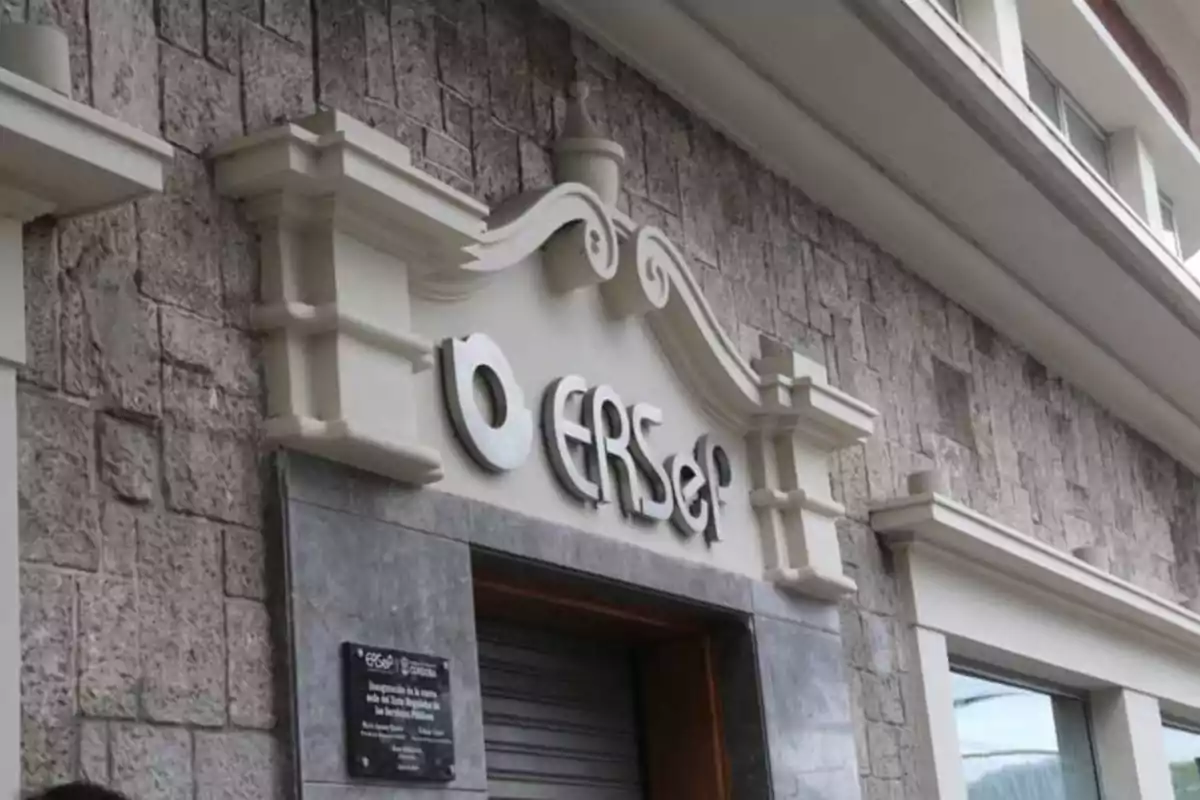 Facade of a stone building with a sign that says ERSEP above the main entrance Facade of a stone building with a sign that says ERSEP above the main entrance