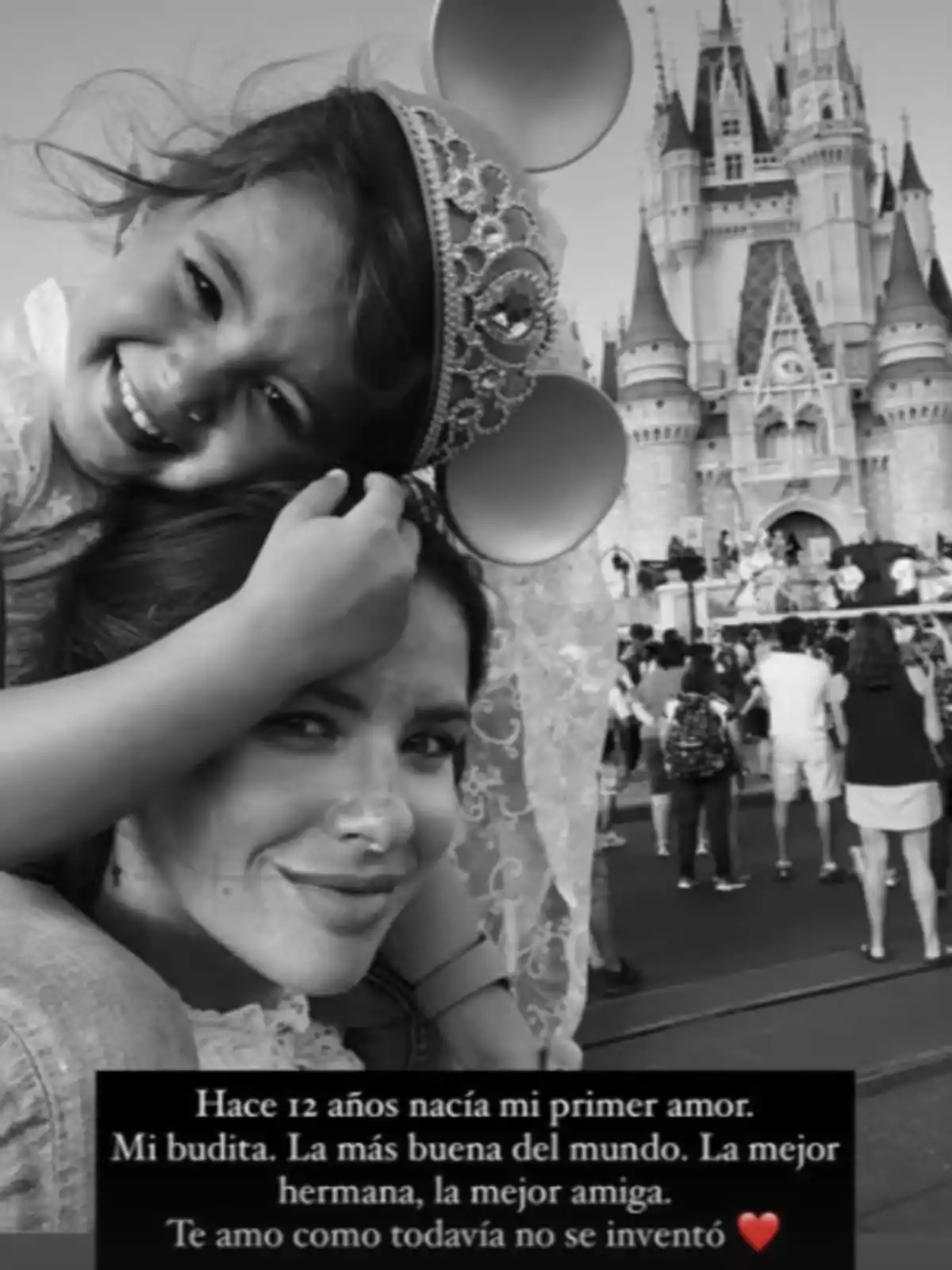 A smiling girl with princess ears and a woman pose in front of a castle at a theme park, surrounded by tourists, with an emotional message about love and family at the bottom of the image. A smiling girl with princess ears and a woman pose in front of a castle at a theme park, surrounded by tourists, with an emotional message about love and family at the bottom of the image.