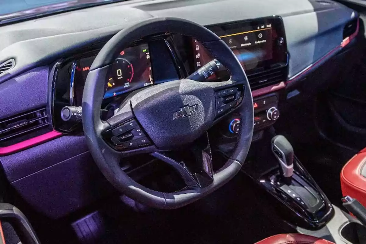 Interior of a Chevrolet car with multifunction steering wheel, digital dashboard, and automatic gear lever Interior of a Chevrolet car with multifunction steering wheel, digital dashboard, and automatic gear lever
