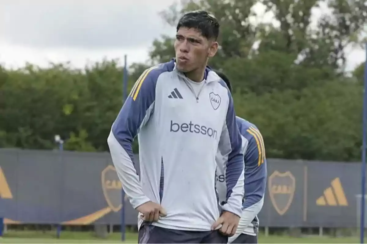 Soccer player wearing Boca Juniors training gear on an outdoor field Soccer player wearing Boca Juniors training gear on an outdoor field
