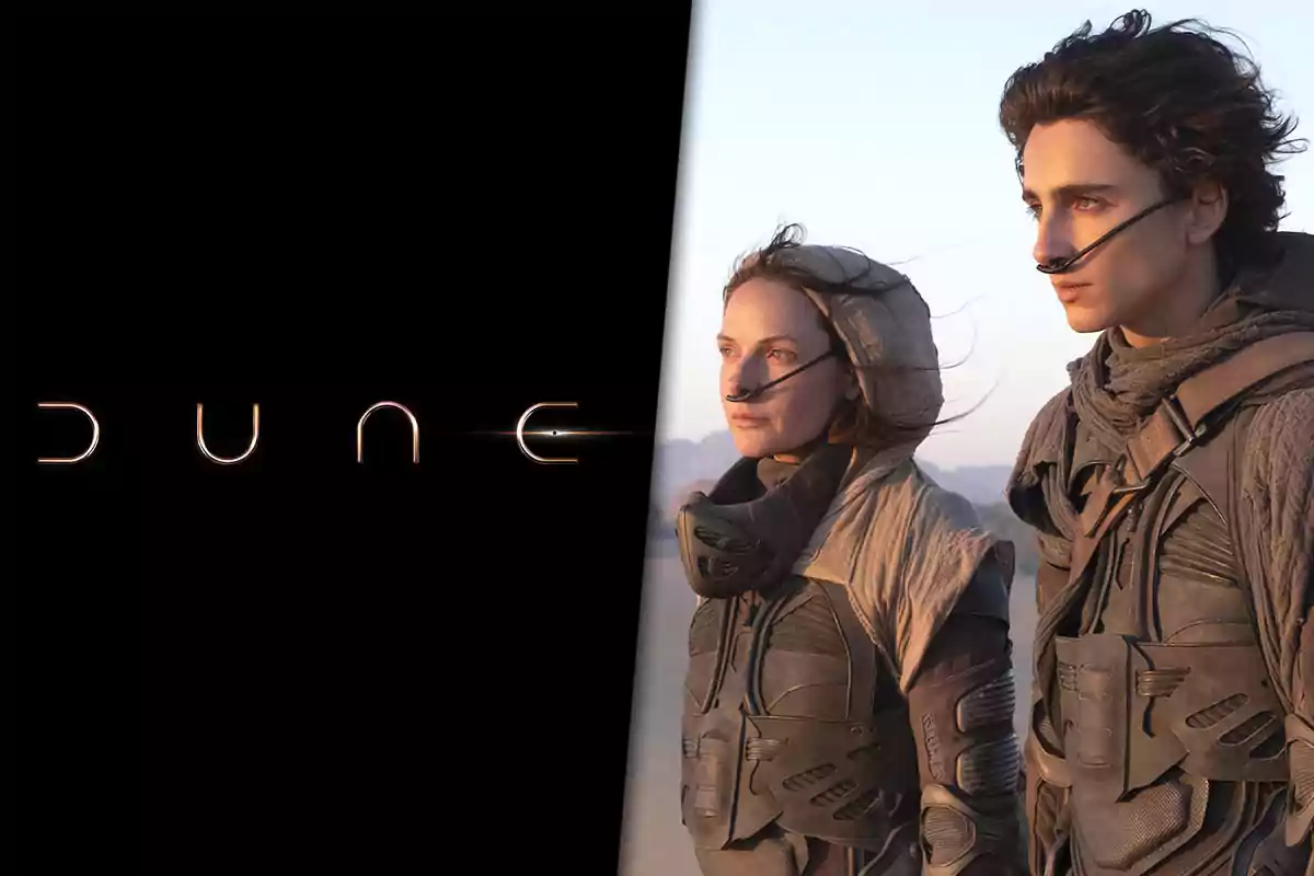 Two characters in futuristic suits in a desert landscape next to the Dune movie logo on a black background