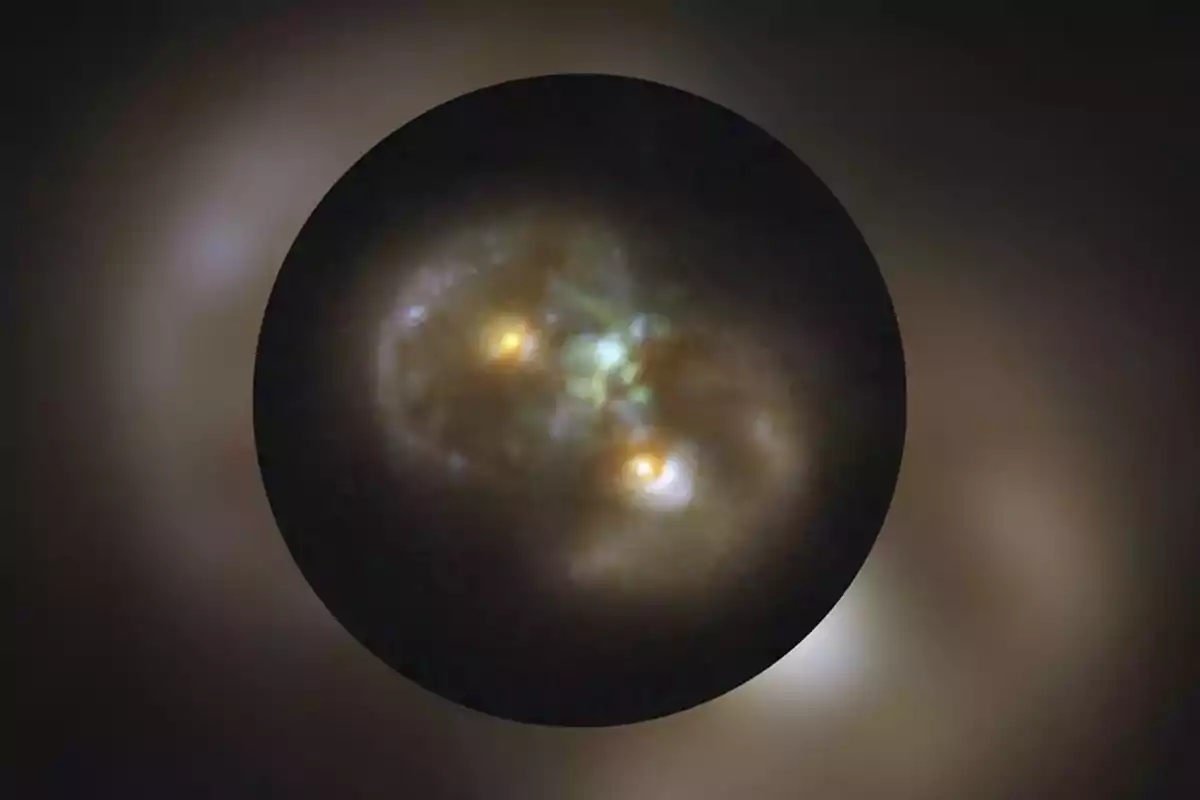 Image of two galaxies merging, with bright cores and illuminated gas clouds in deep space Image of two galaxies merging, with bright cores and illuminated gas clouds in deep space