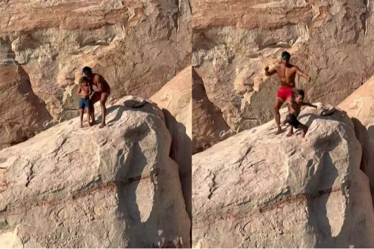 Two people on top of a rock getting ready to jump into the water in a rocky natural setting