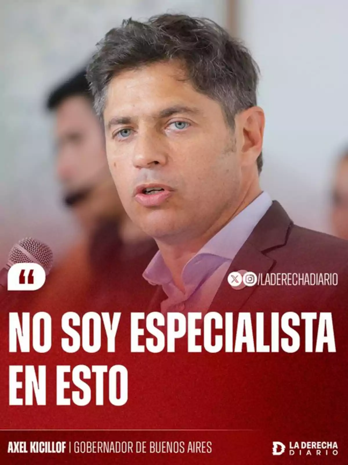 Short-haired man with light eyes speaking in front of a microphone with large text that says I am not an expert in this. Short-haired man with light eyes speaking in front of a microphone with large text that says I am not an expert in this.