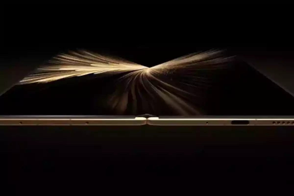 Partially open golden foldable device with a black background and golden sparks emerging from the center Partially open golden foldable device with a black background and golden sparks emerging from the center