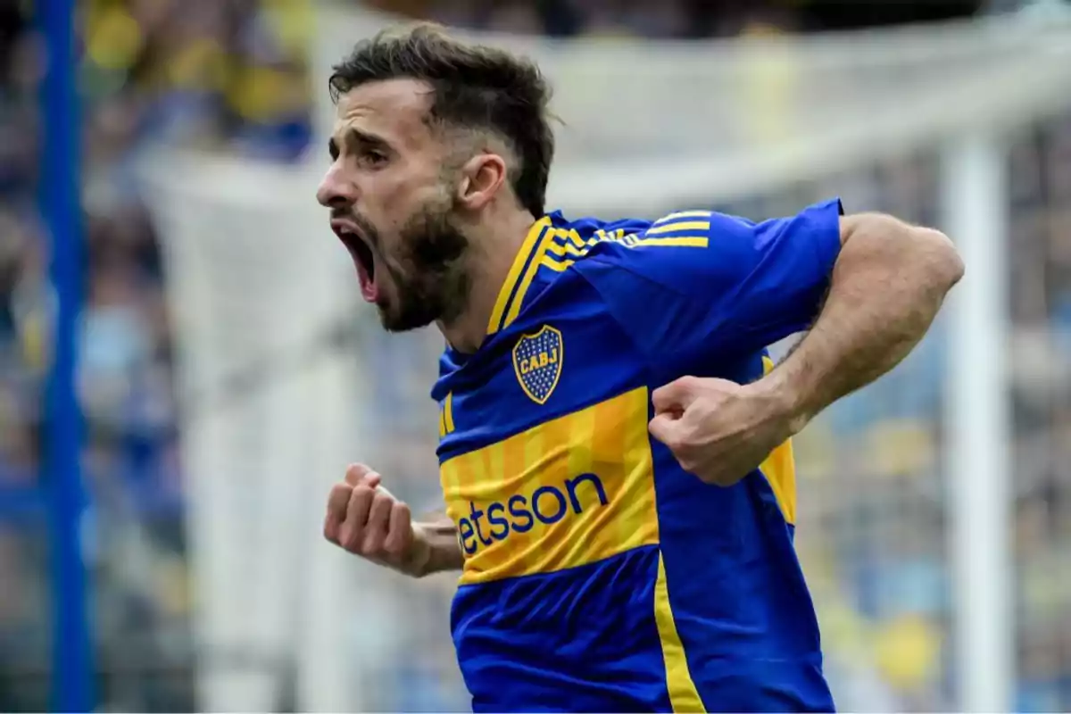 Boca Juniors player celebrating a goal with a clenched fist and shouting excitedly in the stadium Boca Juniors player celebrating a goal with a clenched fist and shouting excitedly in the stadium