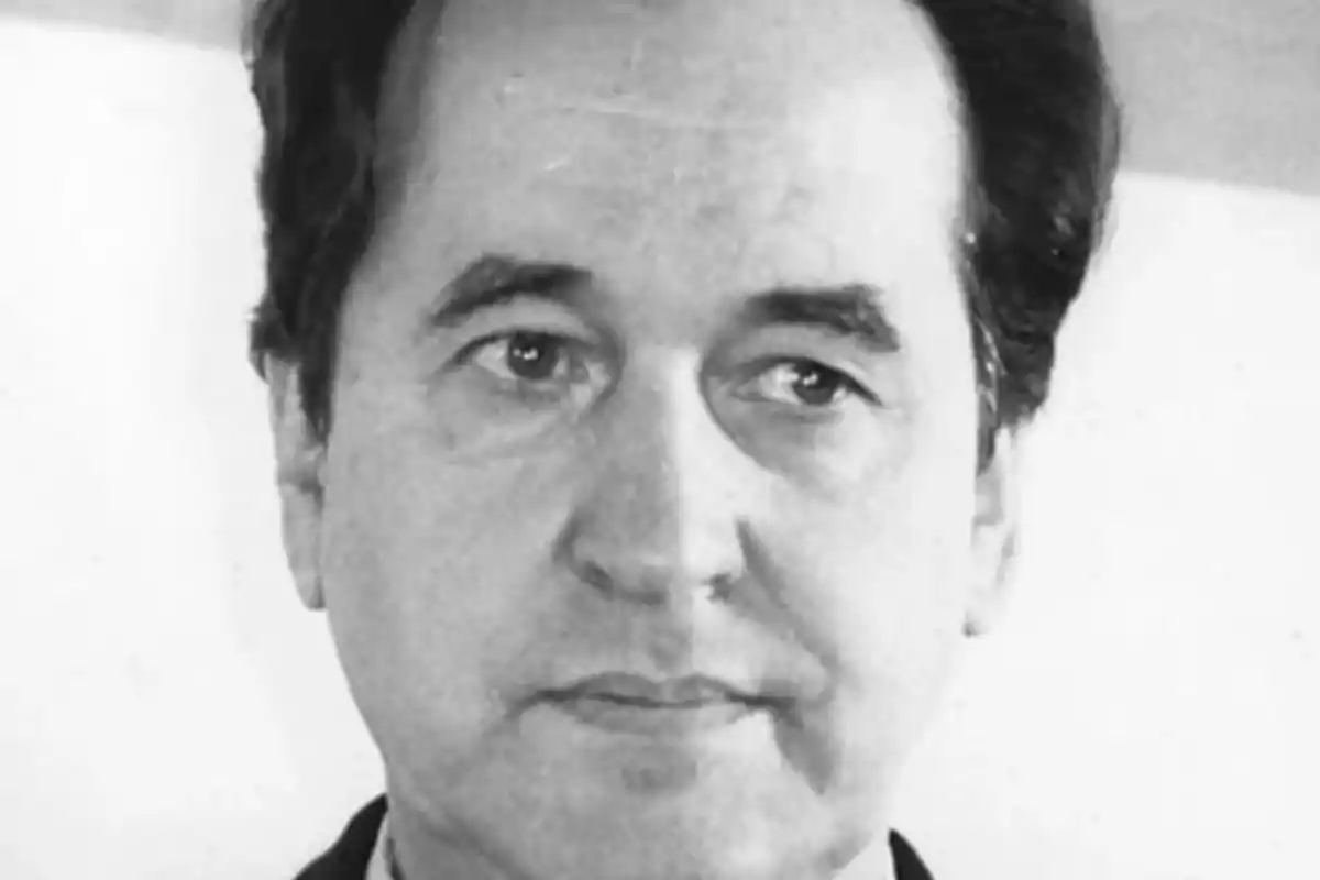 Black and white portrait of a middle-aged man with a serious expression and dark hair slicked back Black and white portrait of a middle-aged man with a serious expression and dark hair slicked back